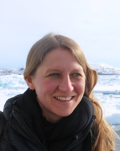 A photo of Dr. Lill Rastad Bjorst smiling against an ice field.