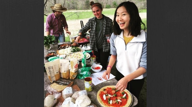 Students make pizza with ingredients from the organic farm.